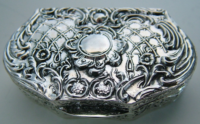 ENGLISH STERLING SILVER PILL BOX BAROQUE  EMBOSSED WITH CENTRAL PLAQUE