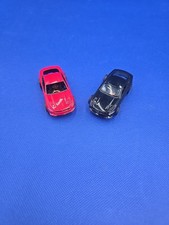 2 Auto World Xtraction Red And Black Ford Mustang GT HO Scale Slot Car. S24