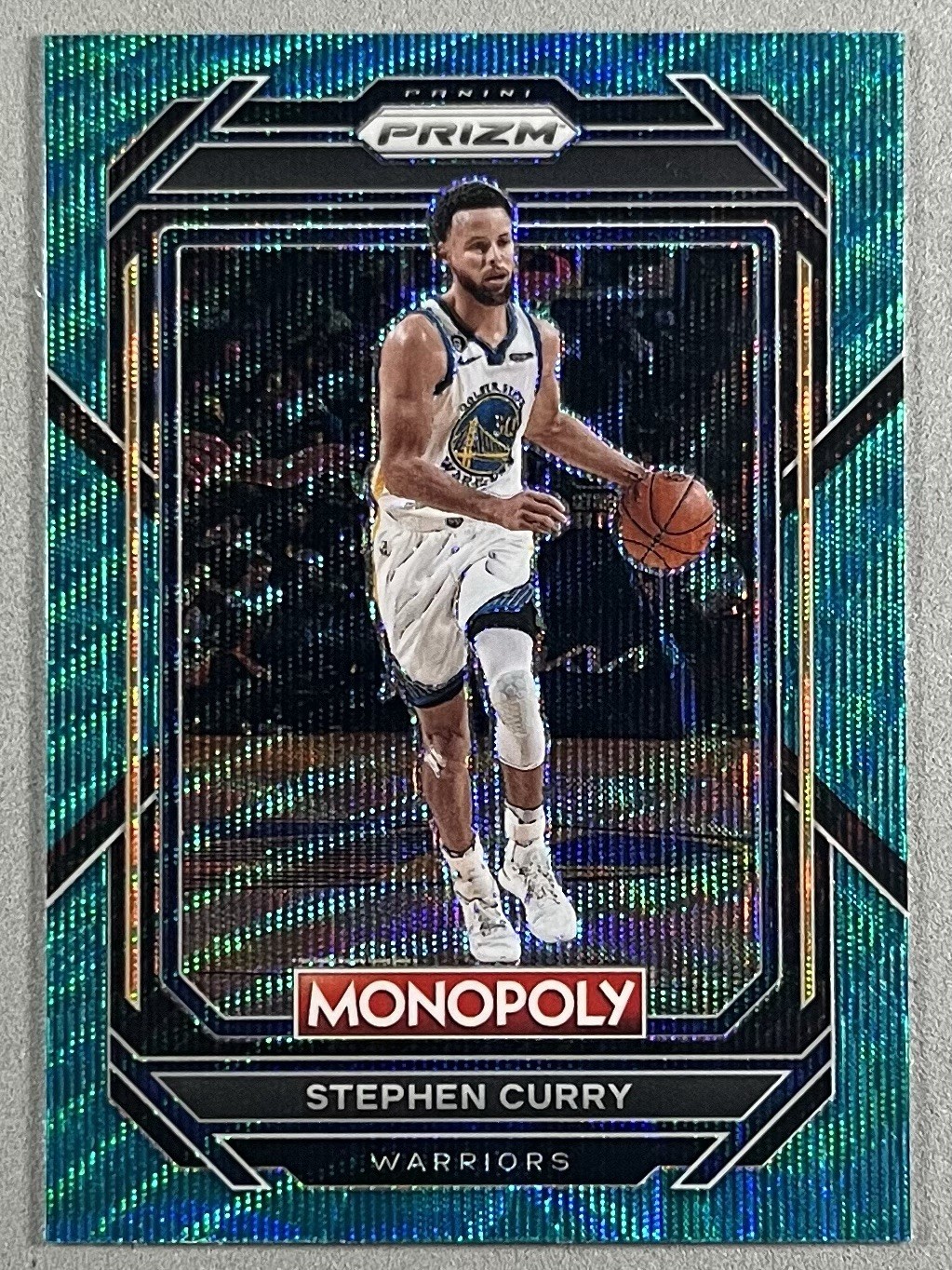 Stephen Curry 2022-23 Panini Prizm Monopoly Teal Wave Prizm SP - Warriors #28