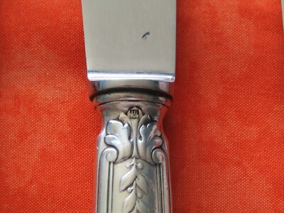 9 couteaux en métal argenté Frionnet François modèle rare aux lauriers