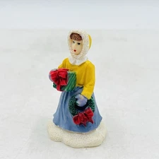 Christmas Village Figure Woman w/ Gift & Wreath - Yellow Coat Winter Decor