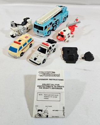 G1 Transformers Defensor Protectobots Lot 1986 Hasbro Vintage mit Handbuch