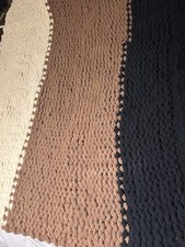 chunky knit blanket featuring three distinct color sections beige brown  black
