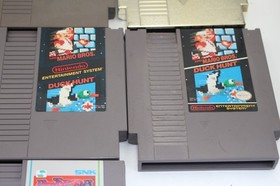 Lotto (10) Giochi Nintendo NES ROTTI; Mario 3 DuckTales Zelda Paperboy Simpsons...