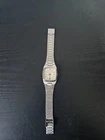 vintage Timex Q Quartz watch square face and a silver-tone metal Bracelet