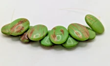 10 GREEN AND GOLD OVAL SELF-SHANKED VINTAGE GLASS BUTTONS