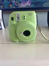 This is a Fujifilm Instax Mini 9 instant camera in the "Lime Green" colorway.
