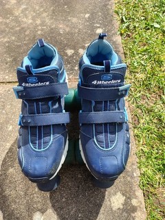 Skechers 4 wheelers/roller skates Navy Blue. Size 5. Used. Do have a few scuffs