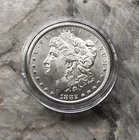 1882 MORGAN SILVER DOLLAR IN BU CONDITION.