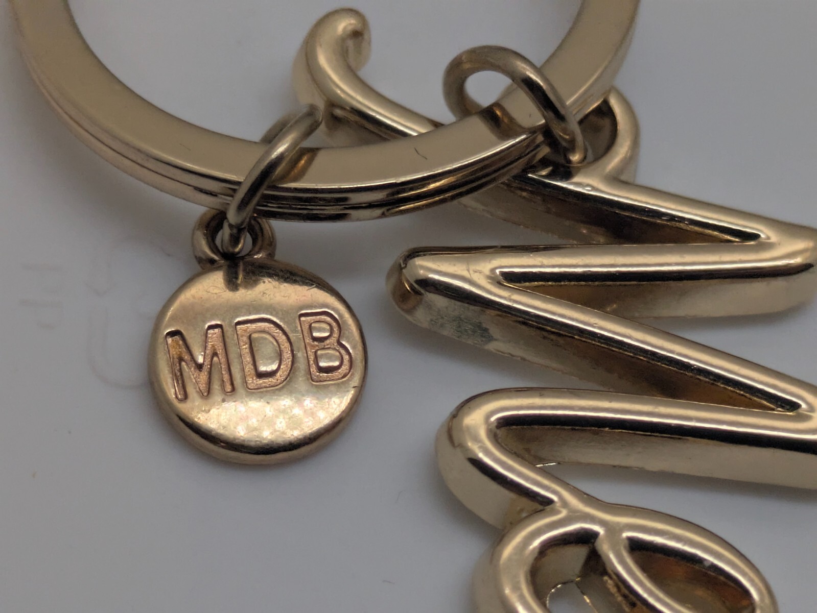 Namesake "Megan" Keychain Gold Toned Metallic