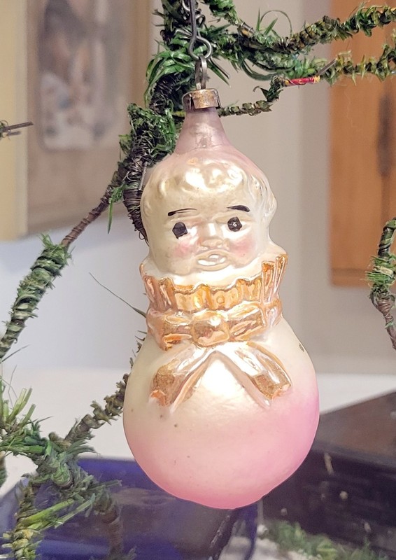 Baby, in Pink Bag, tied with Yellow Ribbon.   Early 1900s German Glass Ornament