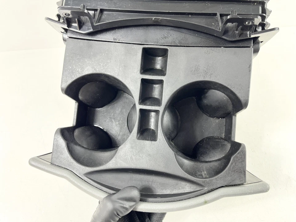 Dodge Caravan Town & Country 2008-2010 consola portavasos deslizante central delantera Foto 3 de 4