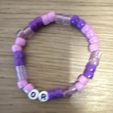 Olivia RodrigoPurple/Clear Plastic Beaded Ela...