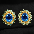 Pristine Swiss Blue Topaz 9.72Ct 925 Sterling Silver 24K Gold Floral Earrings