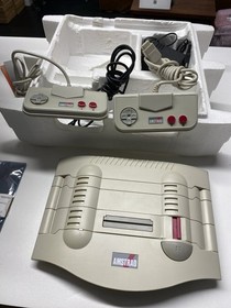 Consola Amstrad GX4000 en caja con 32 carro de juegos