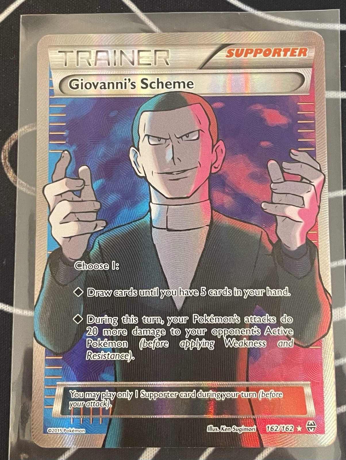 Giovanni’s Scheme 162/162 - Full Art - Breakthrough Trainer Holo - Near Mint