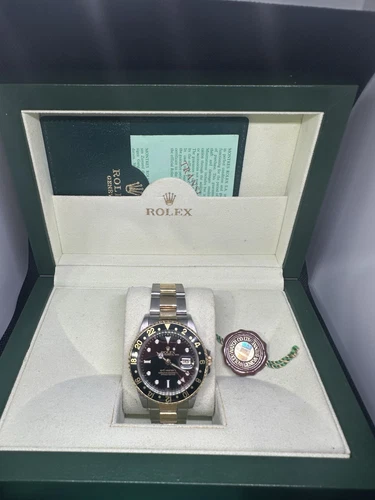 Rolex GMT-Master II 16713 Silver and Gold Oyster Bracelet with Black Bezel