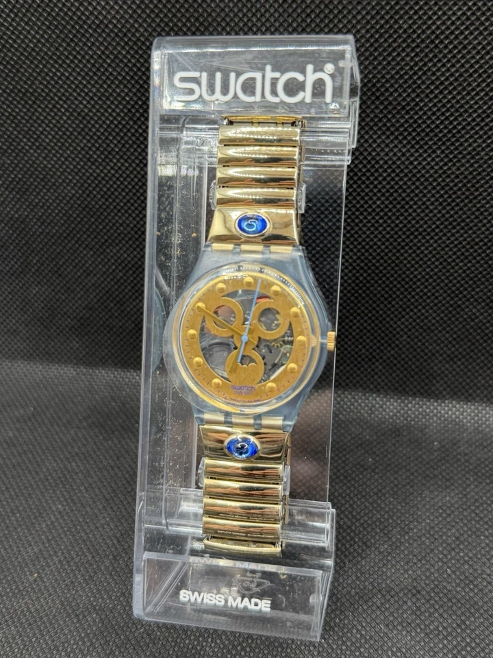 Reloj de cuarzo Swatch Irony Skeleton esfera dorada caja azul - Hecho en Suiza Foto 3 de 4