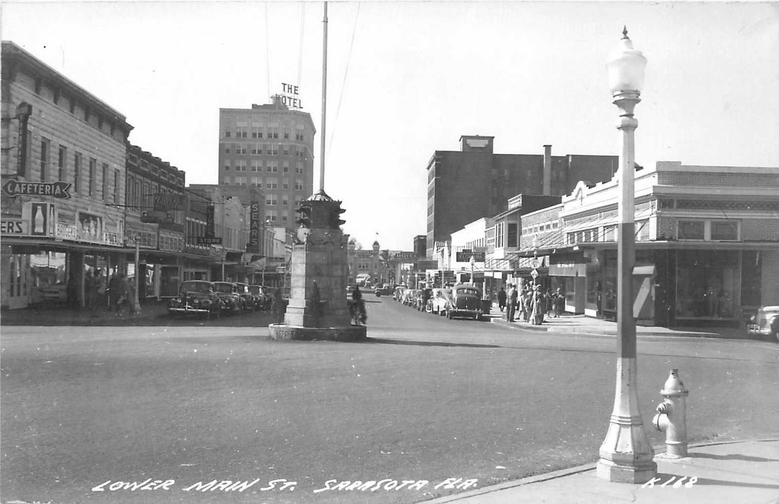 1940s Sarasota Florida Lower Main Street autos business RPPC Postcard 25-8109
