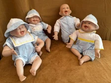 Kathy Hippensteel laughing happy baby Boy Doll lot of 4 porcelain quints squirt