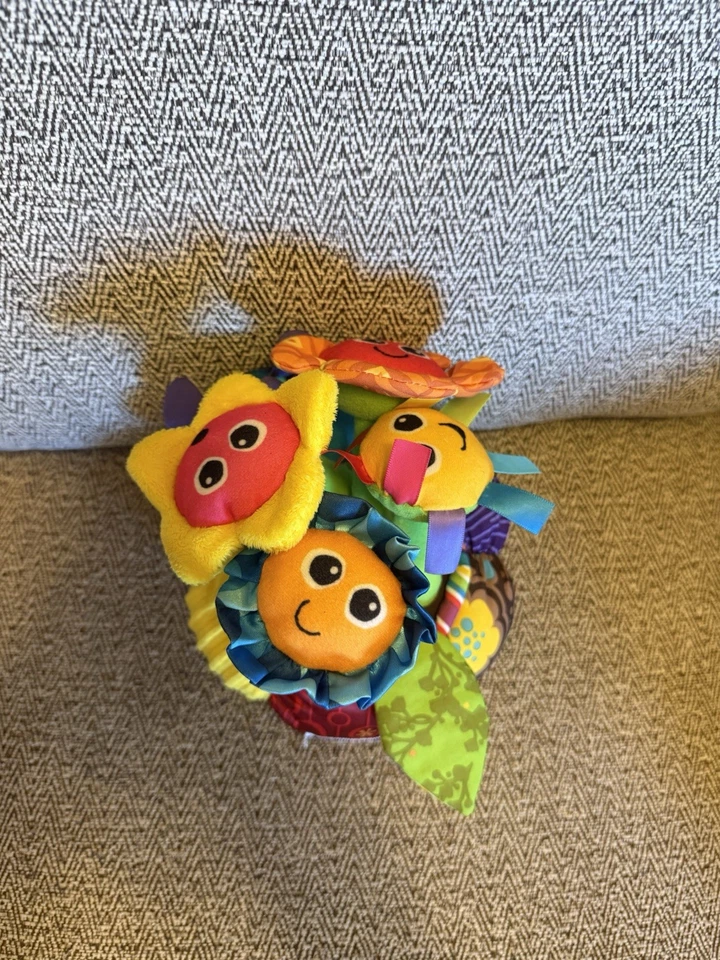 Juguete suave de terapia de desarrollo sensorial musical iluminado para bebé con flores lamaze Foto 2 de 4