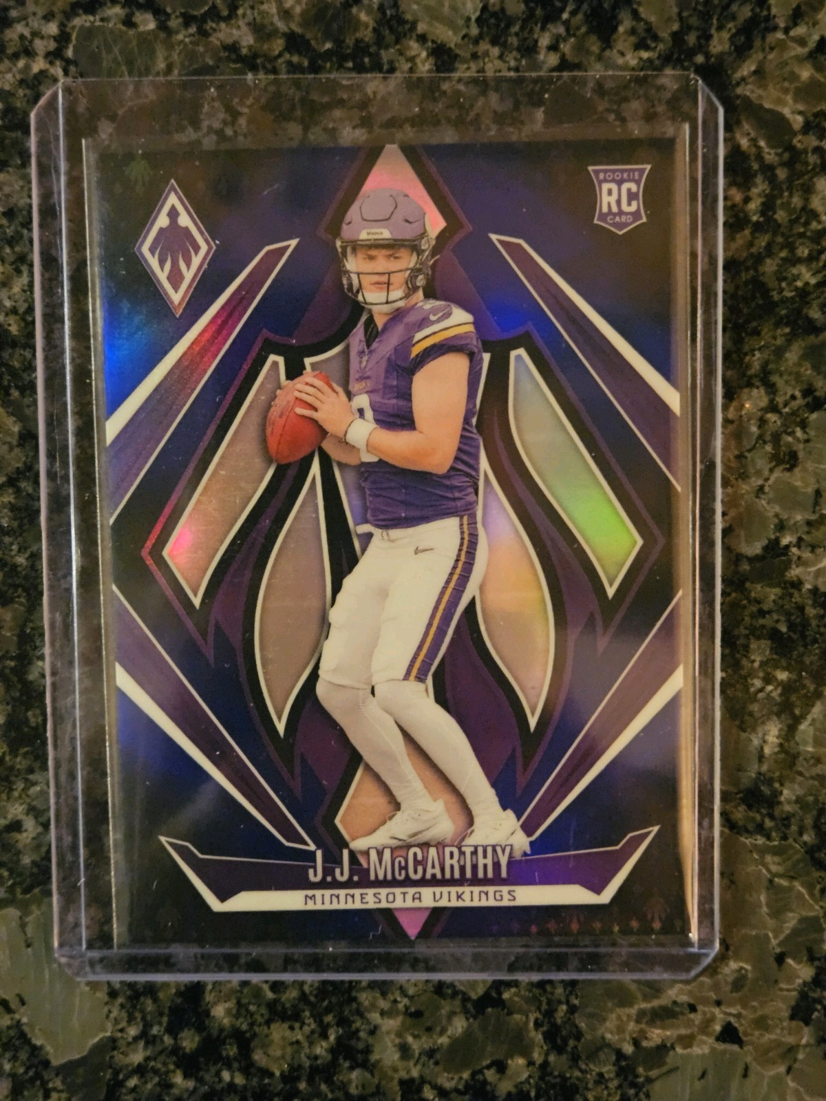 2024 Panini Phoenix - Rookies J.J. McCarthy #185 Blue Fade /249 (RC)