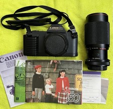 Canon T50 Black 35mm SLR Film Camera w/ Canon FD 35-70mm 75-200mm lenses.