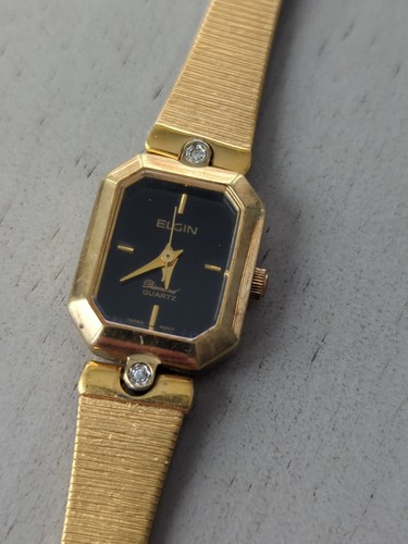 Reloj Elgin ED300-009 Diamantes Talla Batería nueva 5 3/4" dorada negra funcionando - Imagen 7 de 10