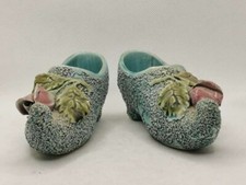 Paire de sabot ancien en barbotine et porcelaine email