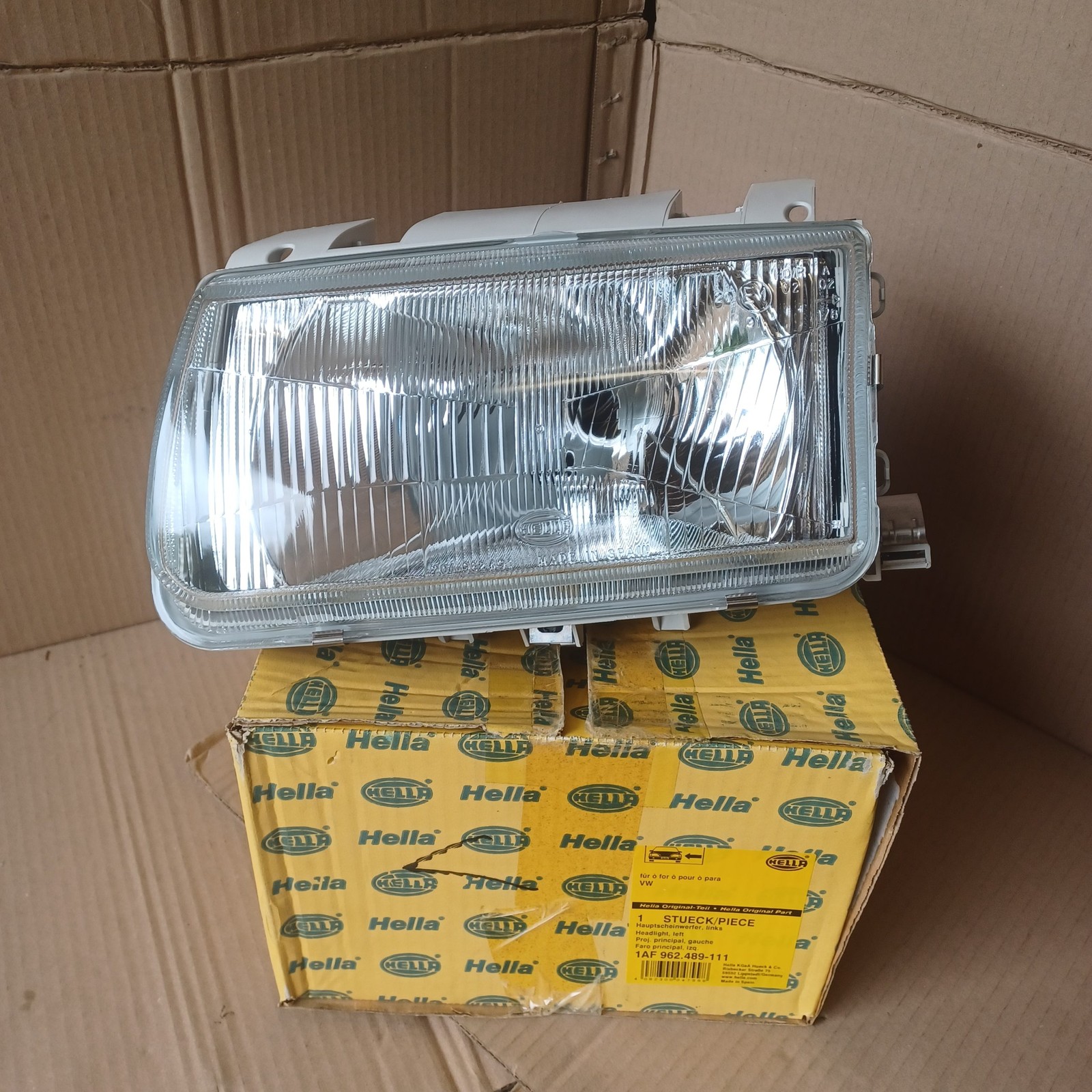 Phare avant gauche VW Polo III 6N1 neuf Hella pour remplacement contrôle technique