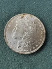 1884 Morgan Silver Dollar $1 – Philadelphia – BU Attractive Toning