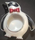 This is a Bath & Body Works penguin scent portable car air freshener visor clip — photo 3