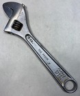 Vintage PROTO Tools No. 706 adjustable crescent wrench with silver handle, black markings, and “Forged Alloy Steel” text.