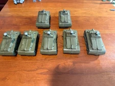 AUBURN RUBBER ** SEVEN TANKS (FIVE COMPLETE, TWO MISSING THE SILVER HEAD ON TOP)