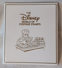 THE DISNEY WORLD ALBUM OF 225 POSTAGE STAMPS, PLUS A DISNEY DOLLAR & CERTIFICATE