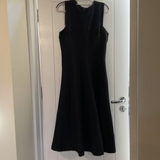classic black sleeveless dress designed with timeless elegance