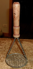 vintage unbranded handheld twisted wire wood handle potato masher rusty used