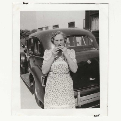 Vintage Snapshot Photo 1930s Woman Eating Outside Floral Apron Car Americana