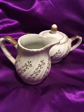 Dainty White Creamer And Sugar Bowl With Delicate Gold Leafy Design