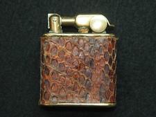 ANCIEN BRIQUET VINTAGE ELVE COUVERTURE PEAU ARTISANAL FAIT MAIN COLONIES?