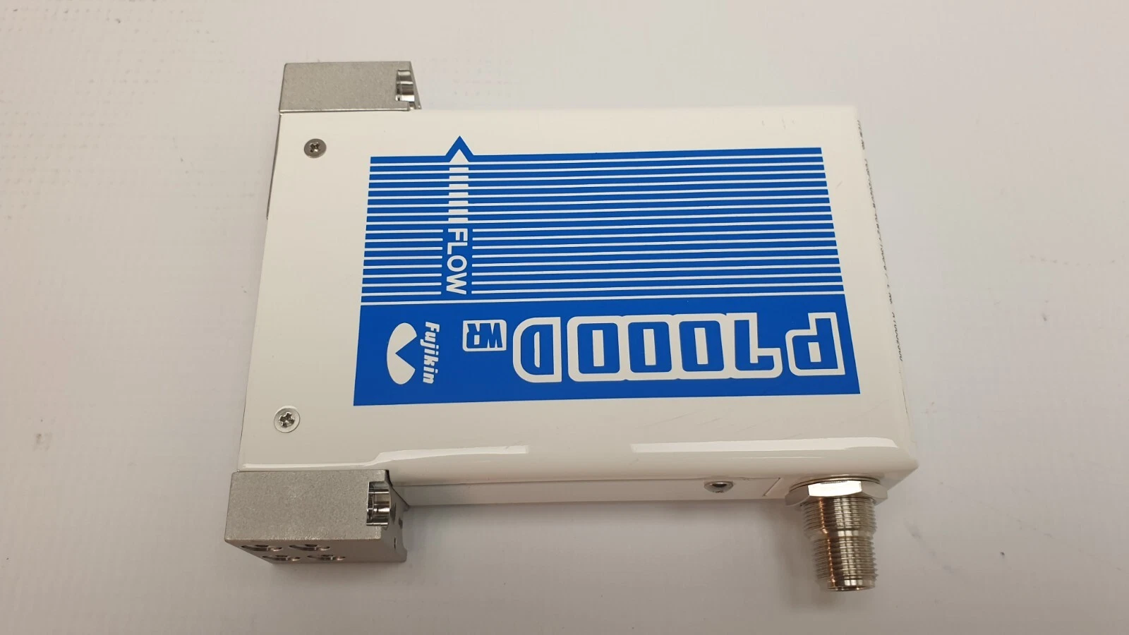 Fujikin P7000D WR branding and flow arrow on the 1300 SCCM unit