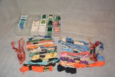 TWO PLASTIC STORAGE CONTAINERS WITH BOBBINS AND EMBROIDERY FLOSS CROSS STITCH