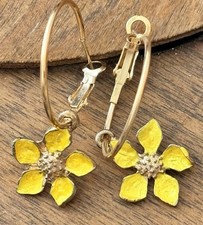 Beautiful Yellow Flowers and Gold Hoop Earrings. Bloom