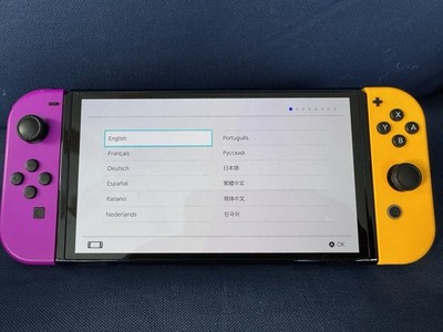 Nintendo Switch - OLED Model with original yellow -purple Joy-Cons