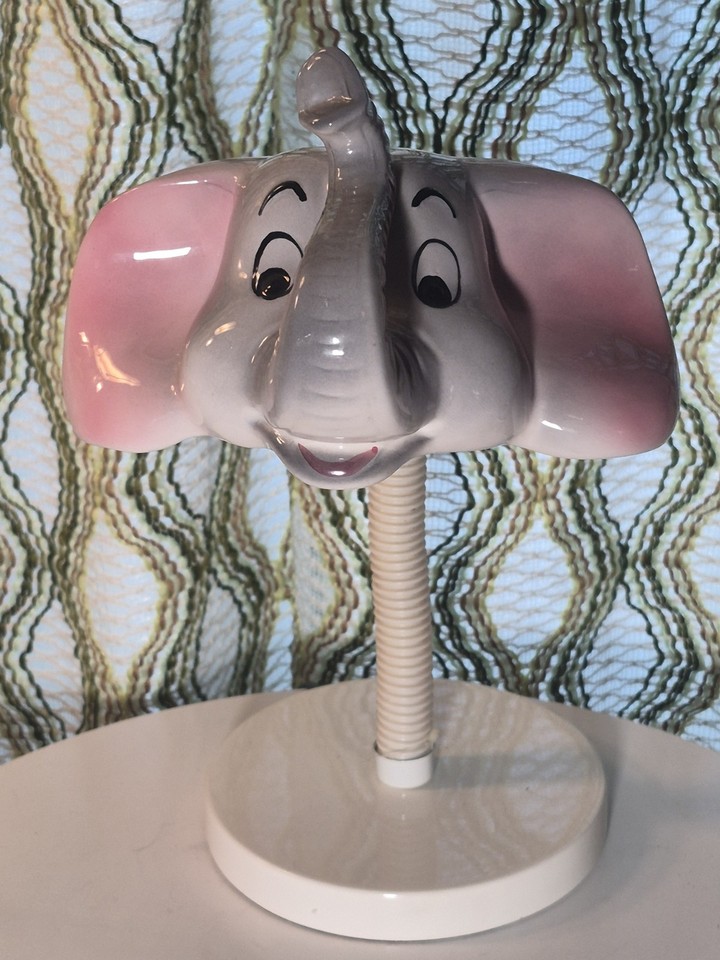 A ceramic elephant head on a gooseneck desk lamp is the kind of gloriously weird vintage oddity that becomes the first thing every guest asks about.