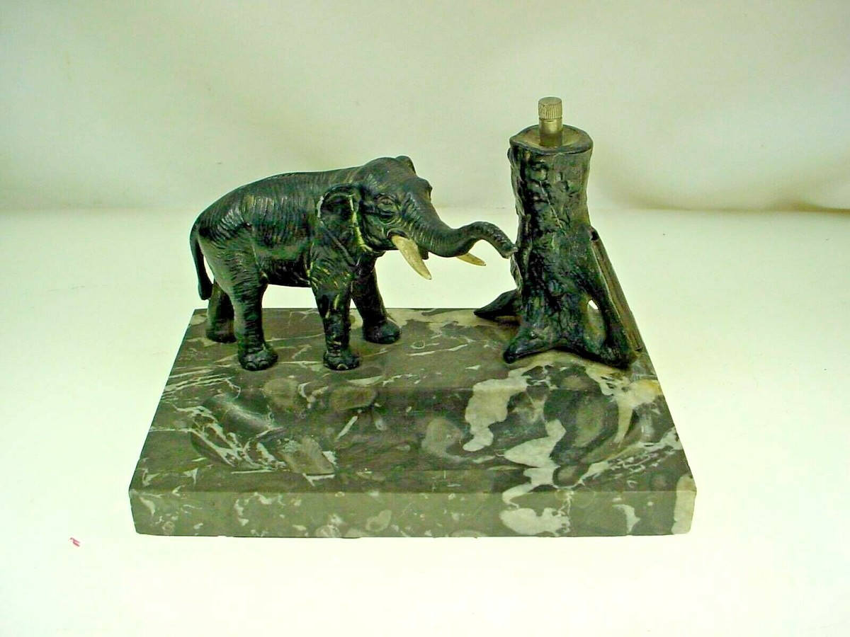elephant cigarette lighter India Restoration Delicate swirls and floral designs are fused into this lighter to create an elephant design Vintage/Antique 1930s40s Strikalite Composition Elephant