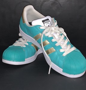 teal and gold shoes