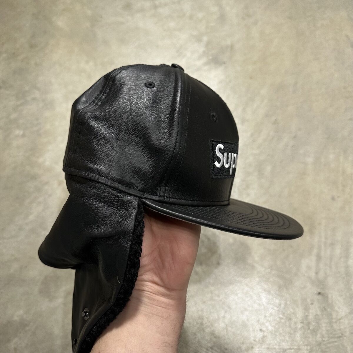 Supreme x New Era Leather Ear Flap Faux Shearling Fitted Hat Supreme x New Era Leather Ear Flap Faux Shearling Fitted Hat