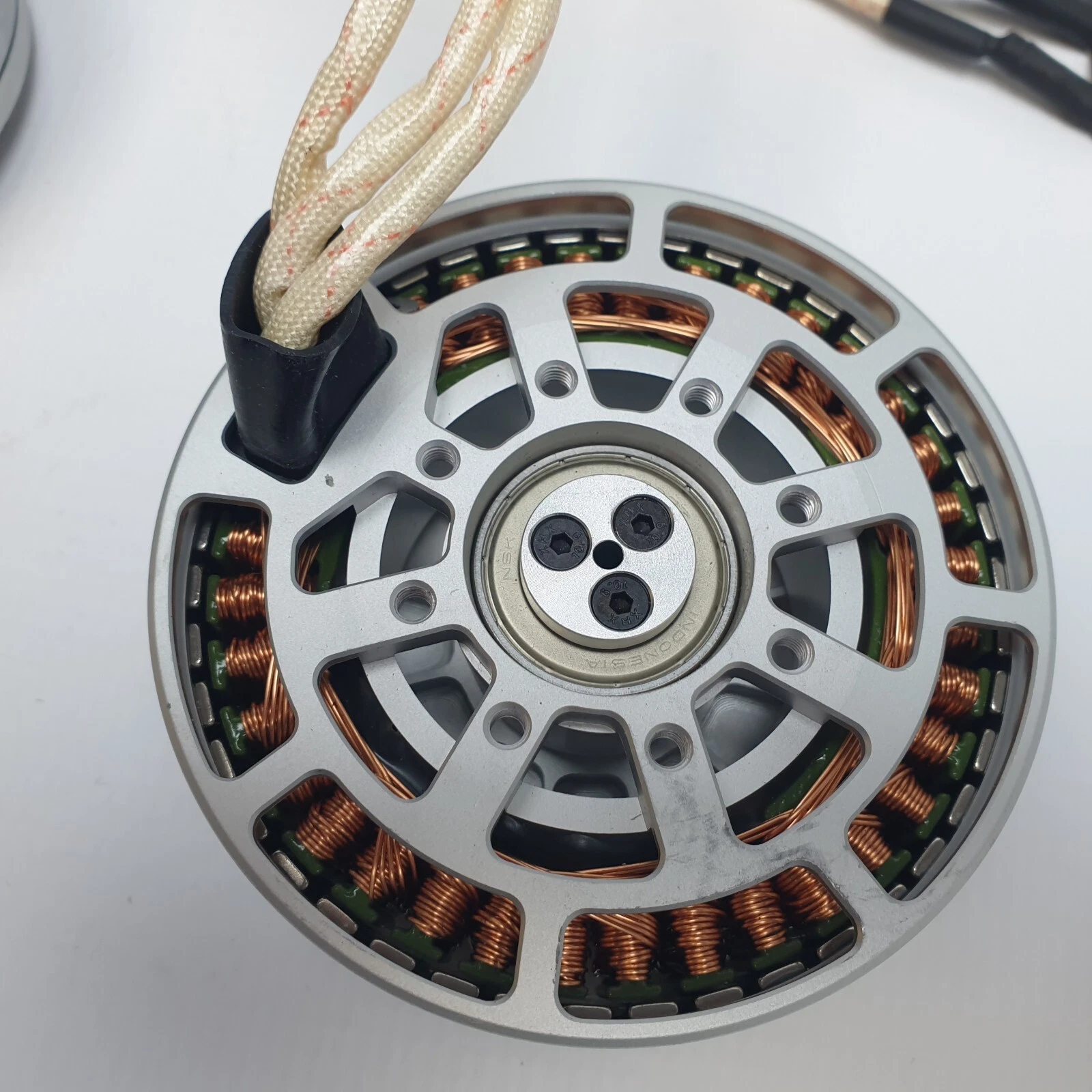 Base of a KV120 motor with stator windings, 3-screw bearing retainer and lead exit