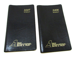 Two Vintage 2007 and 2008 1st International Bank Trust Black Checkbook Covers